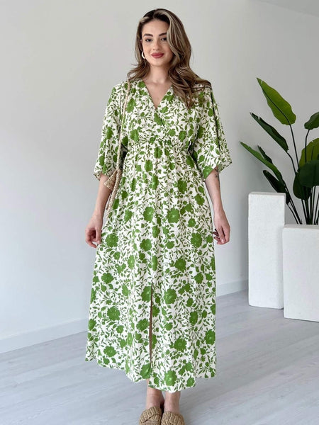 Girl green floral rayon dress side pose