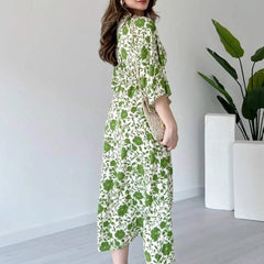 Girl wearing green printed calf length rayon dress