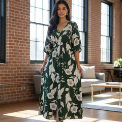 Femail green printed rayon dress walking pose
