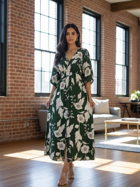 Femail green printed rayon dress walking pose
