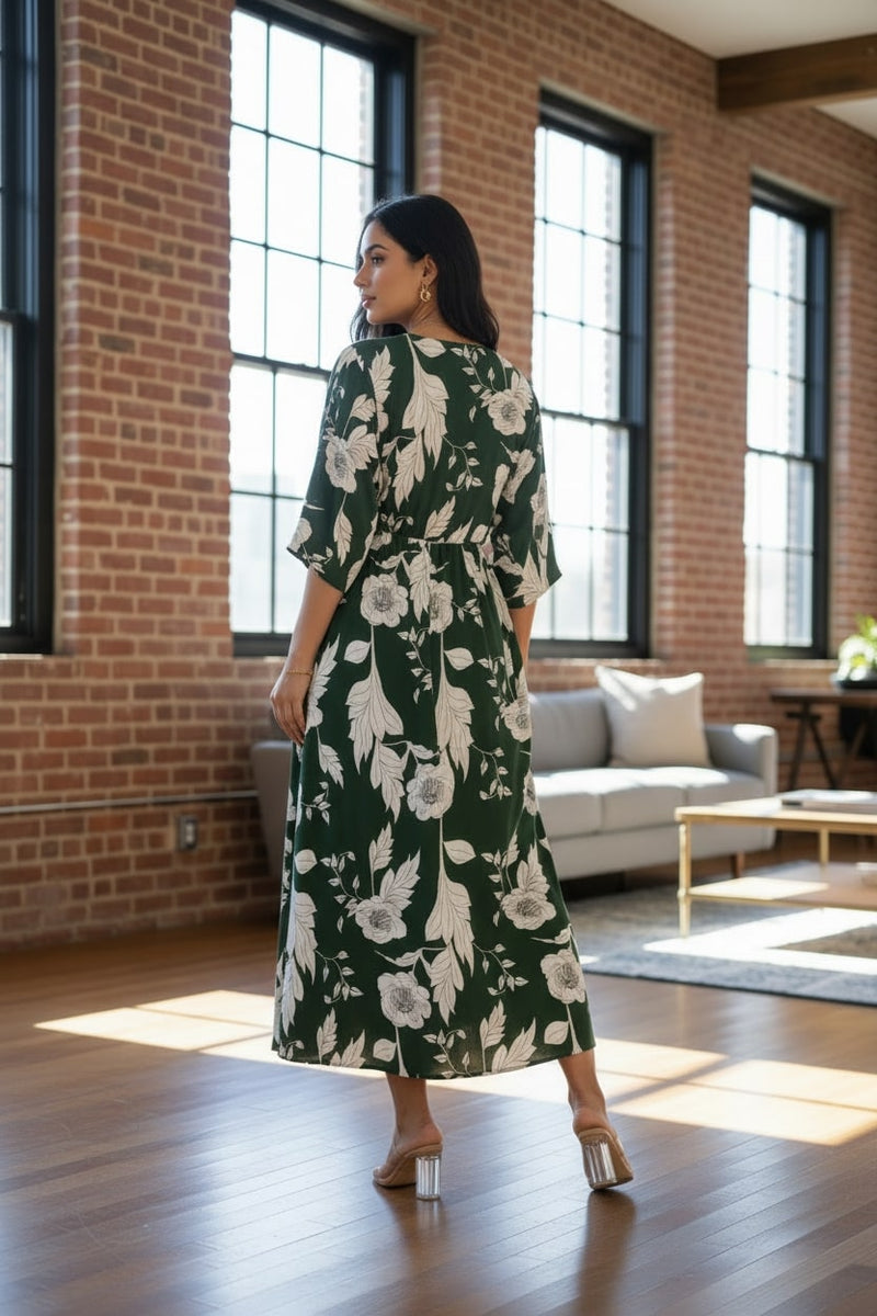 Femail wearing green floral calf length rayon dress
