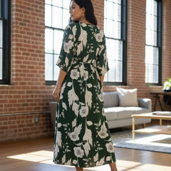Femail wearing green floral calf length rayon dress
