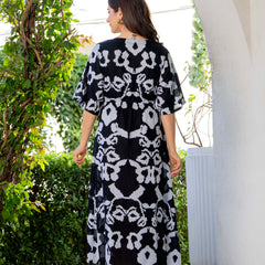 Women wearing black printed calf length dress
