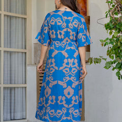Female wearing blue calf length fit and flare dress
