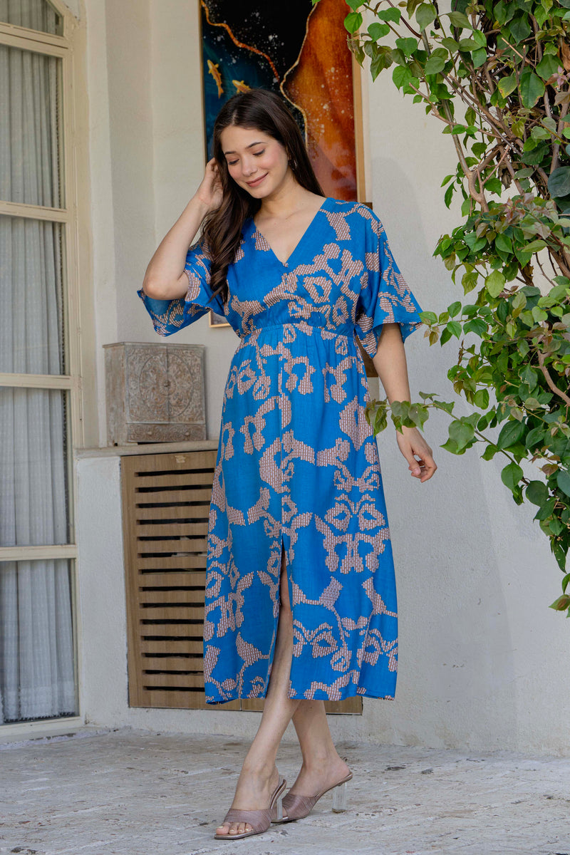 Female wearing blue calf length fit and flare dress
