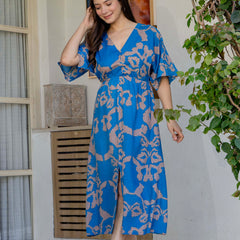 Female wearing blue calf length fit and flare dress
