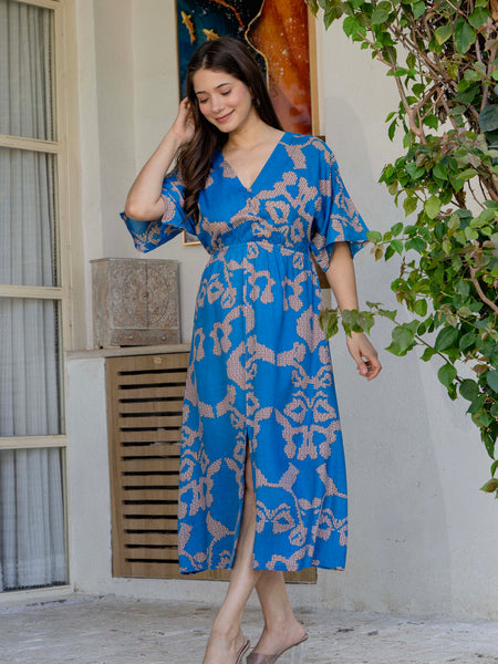 Female wearing blue calf length fit and flare dress
