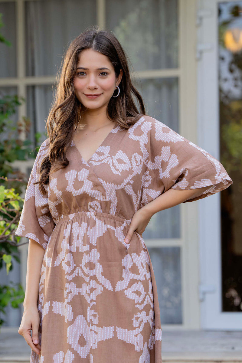 Female wearing grey calf length dress
