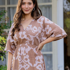 Female wearing grey calf length dress
