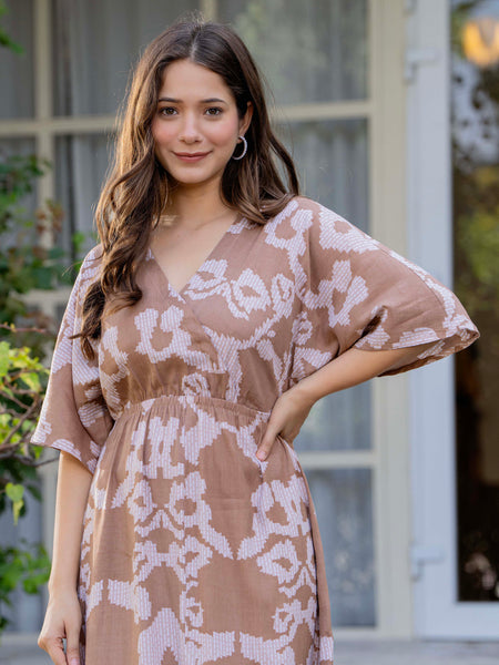 Female wearing grey calf length dress
