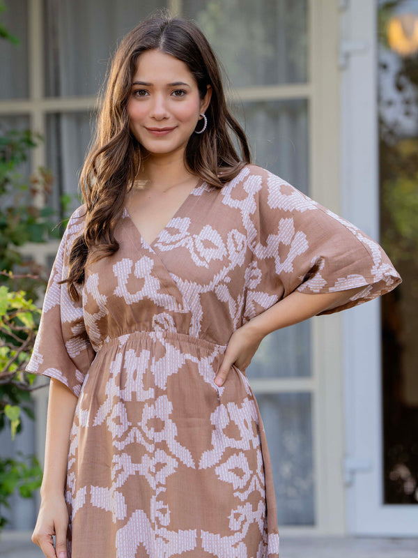 Female wearing grey calf length dress
