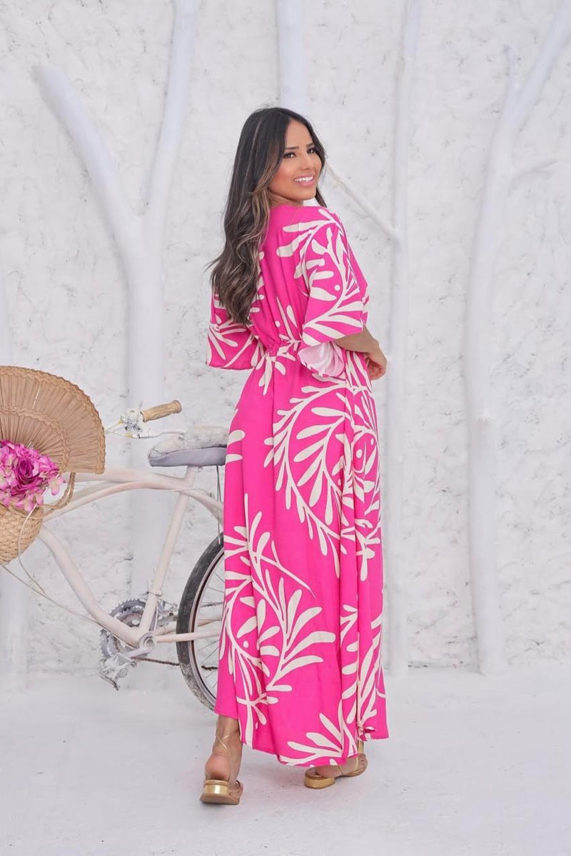 Woman wearing pink calf length rayon dress
