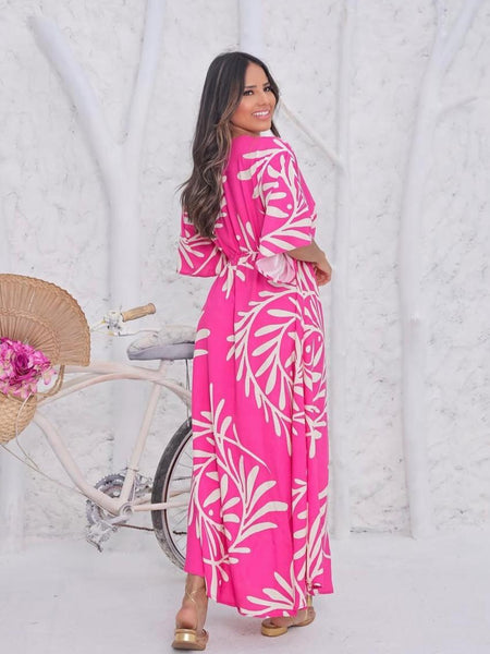 Woman wearing pink calf length rayon dress
