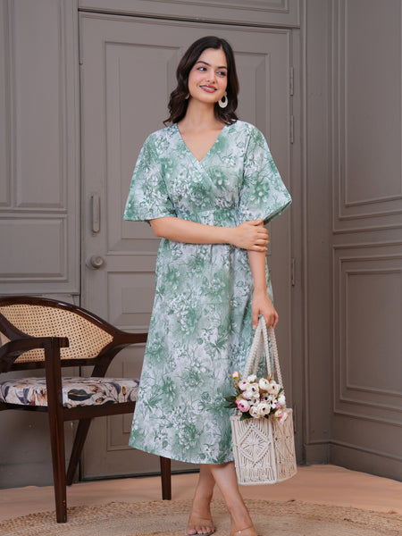 Lady wearing green fit and flare floral dress
