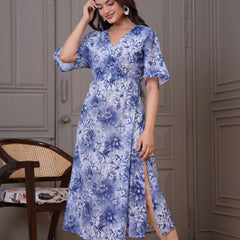 Woman wearing blue fit and flare floral dress
