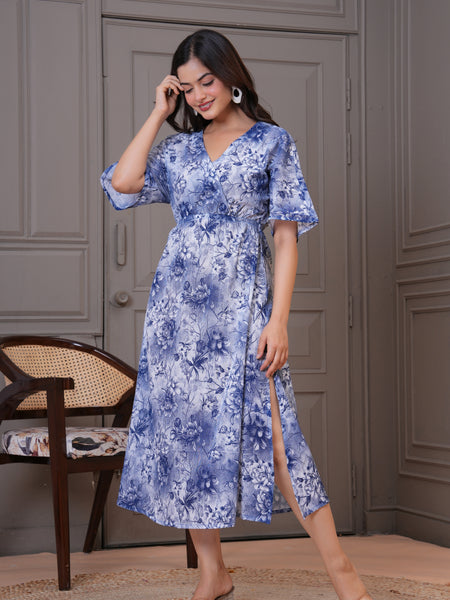 Woman wearing blue fit and flare floral dress
