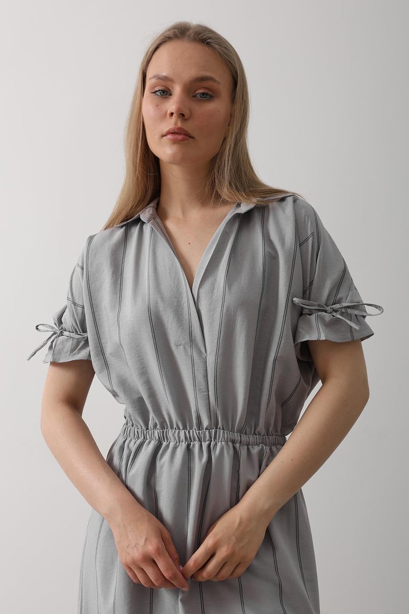 Women wearing grey calf length rayon dress

