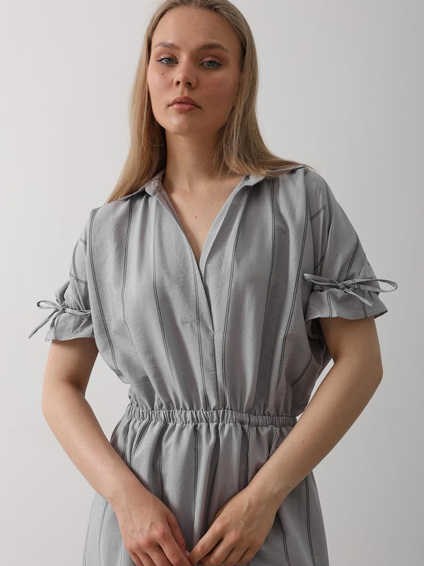 Women wearing grey calf length rayon dress

