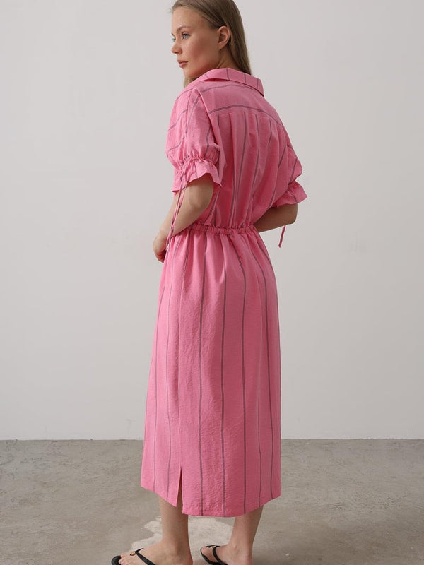 Women wearing pink collar neck calf length dress
