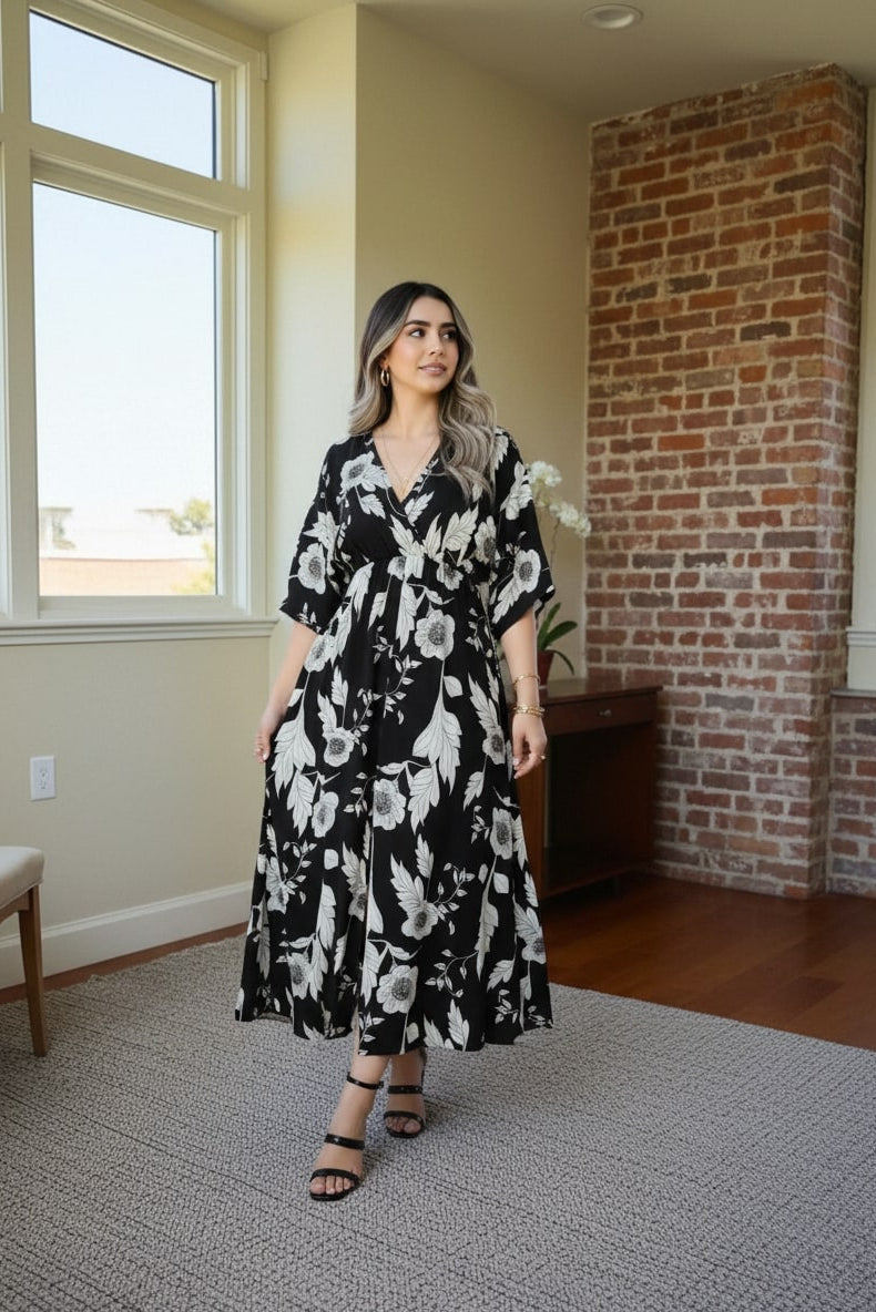 Girl black printed rayon dress walking pose
