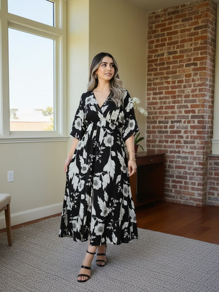 Girl black printed rayon dress walking pose
