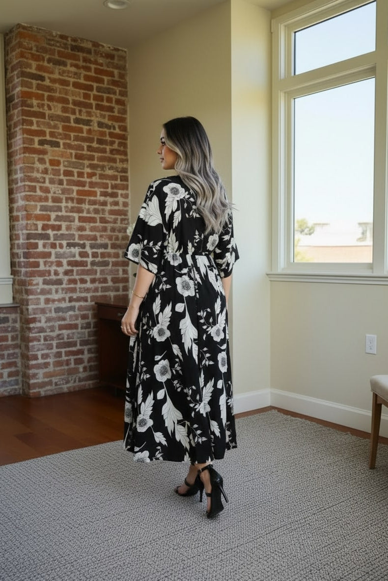 Girl wearing black floral calf length rayon dress
