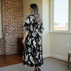 Girl wearing black floral calf length rayon dress
