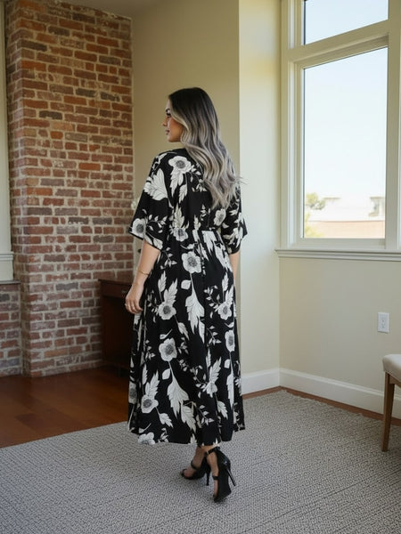 Girl wearing black floral calf length rayon dress
