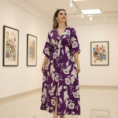 Female wearing purple floral calf length rayon dress
