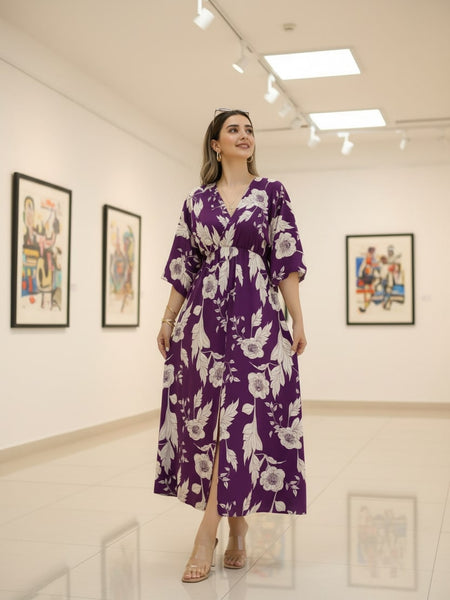 Female wearing purple floral calf length rayon dress
