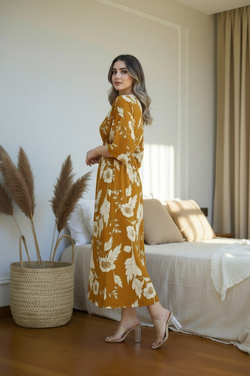 Female wearing yellow floral calf length rayon dress
