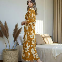Female wearing yellow floral calf length rayon dress
