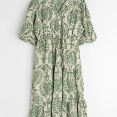 Lady green printed rayon dress side view
