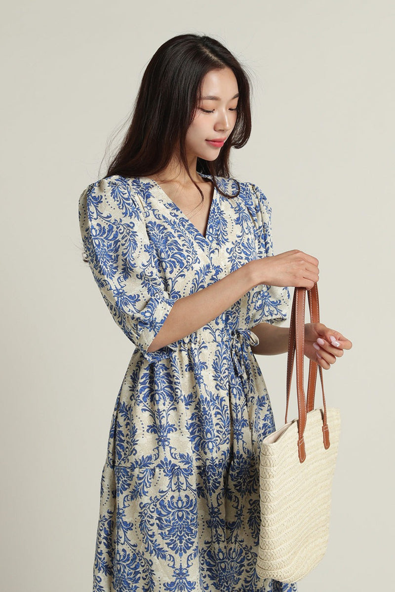 Lady wearing blue rayon calf length dress
