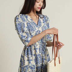 Lady wearing blue rayon calf length dress
