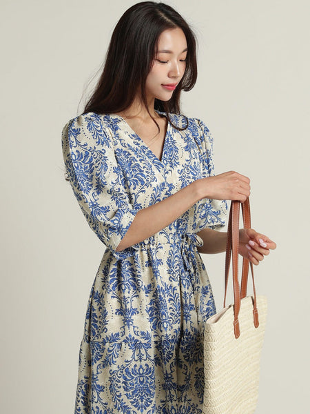 Lady wearing blue rayon calf length dress
