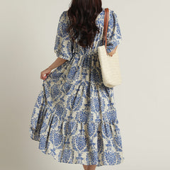 Lady blue fit and flare dress side pose
