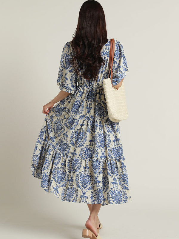 Lady blue fit and flare dress side pose
