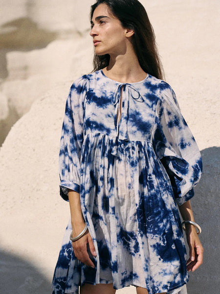 Women wearing white tie dye above knee dress