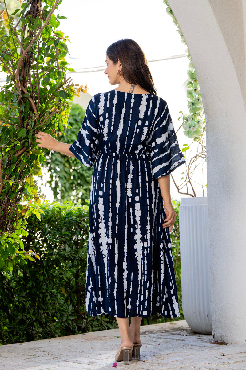 Women wearing blue V neck calf length dress
