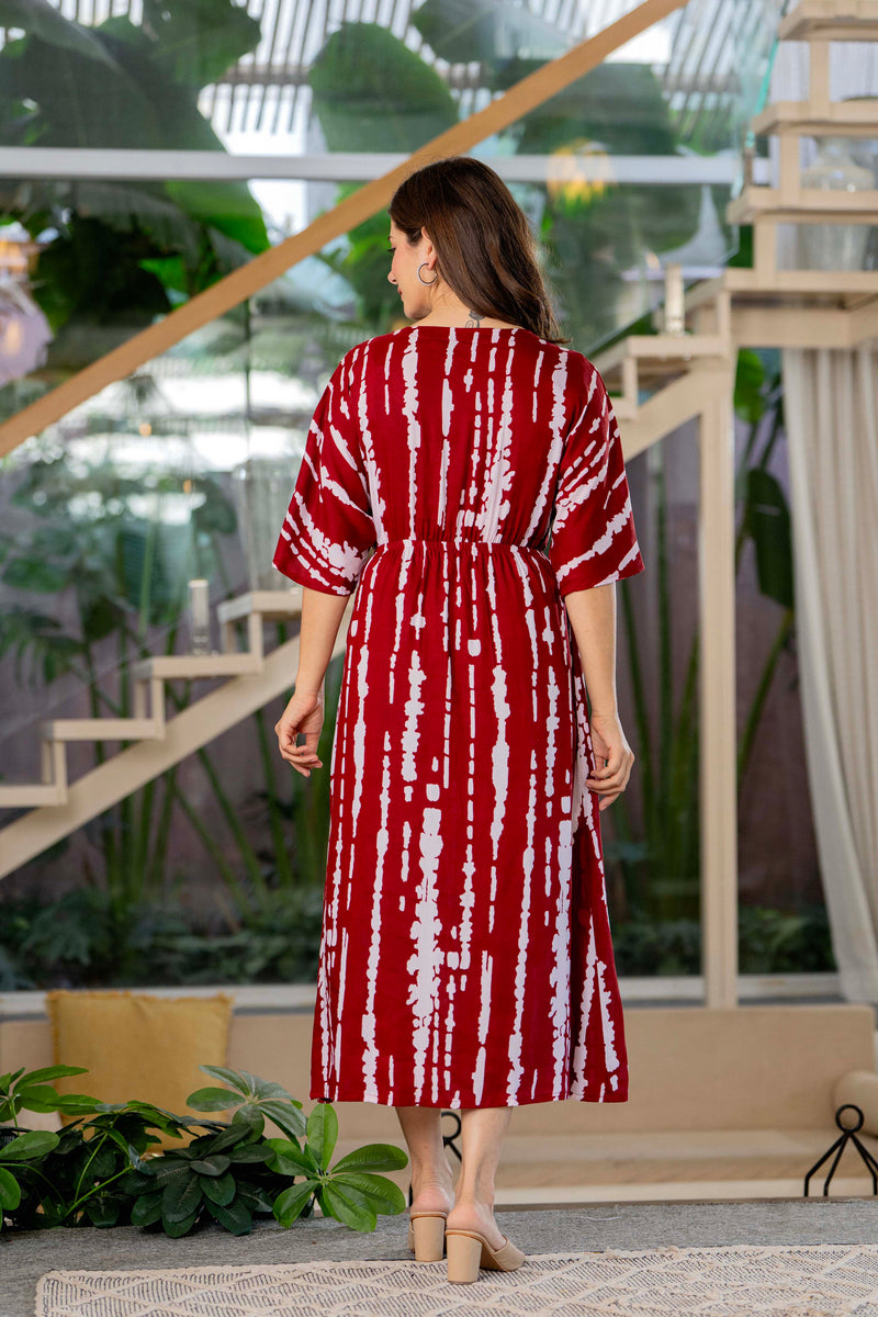 Girl wearing maroon calf length rayon dress
