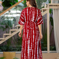 Girl wearing maroon calf length rayon dress
