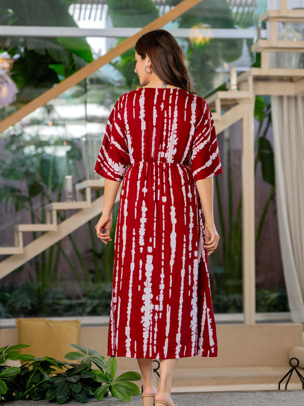 Girl wearing maroon calf length rayon dress
