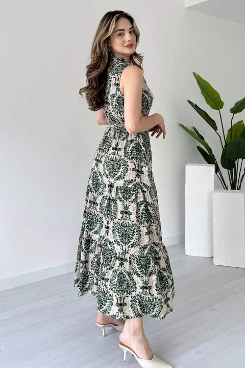 Woman wearing green printed sleeveless rayon dress

