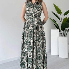 Woman green printed rayon fit and flare dress front view
