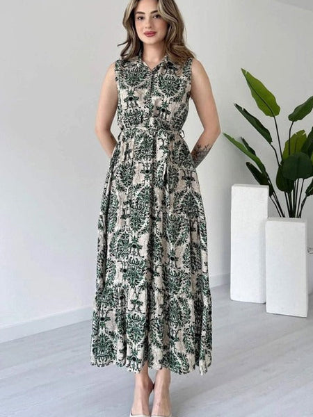 Woman green printed rayon fit and flare dress front view
