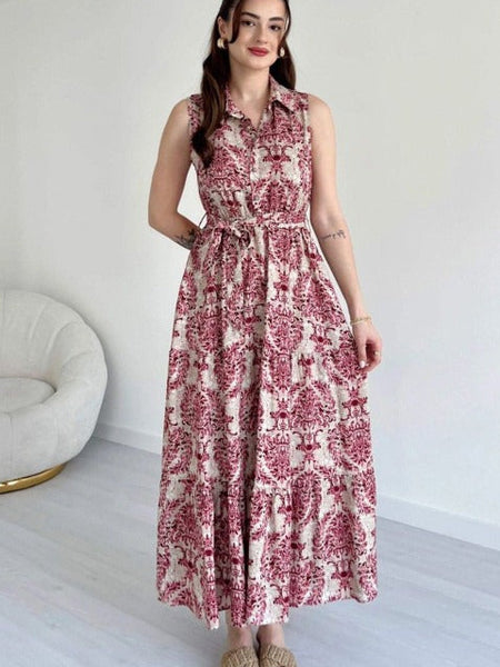 Girl wearing maroon calf length rayon sleeveless dress
