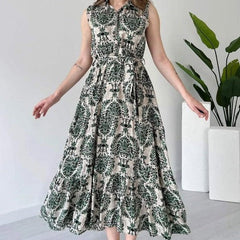 Woman green rayon dress side pose
